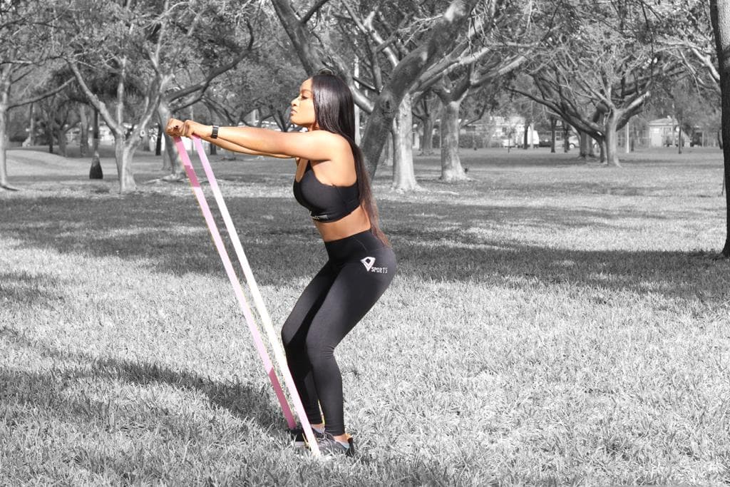 Athlete training outdoors with a Vasato full-body resistance band