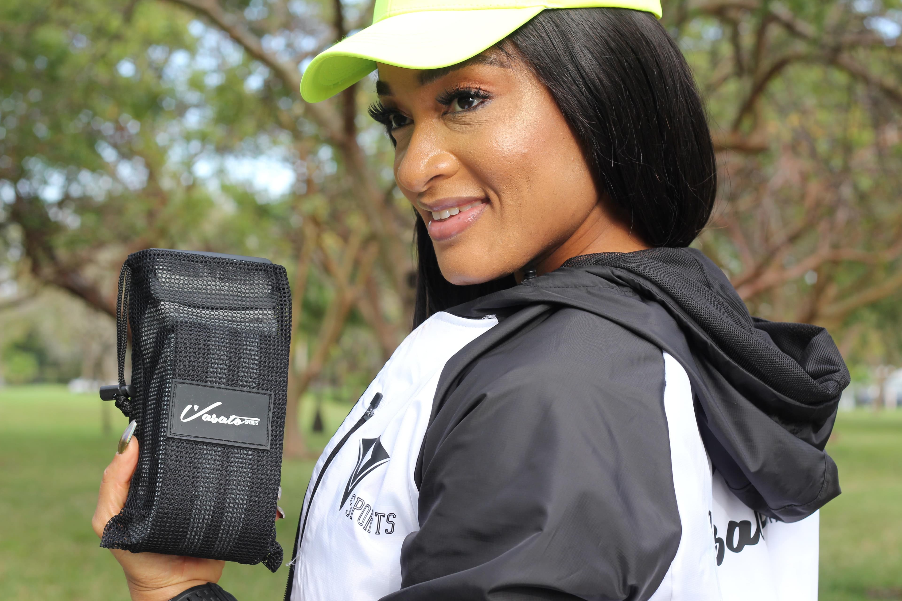 Model holding a Vasato branded sports tool bag outdoors